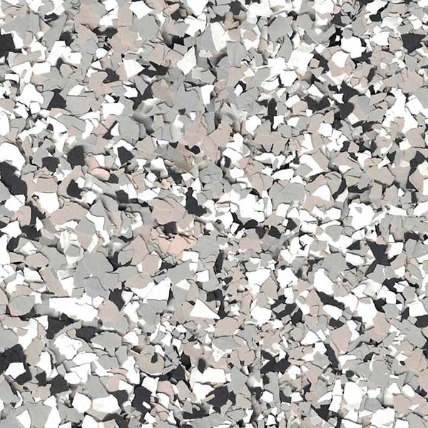 A close-up view of gray, white, and black flecks scattered randomly, resembling a textured, abstract mosaic pattern or surface detail.