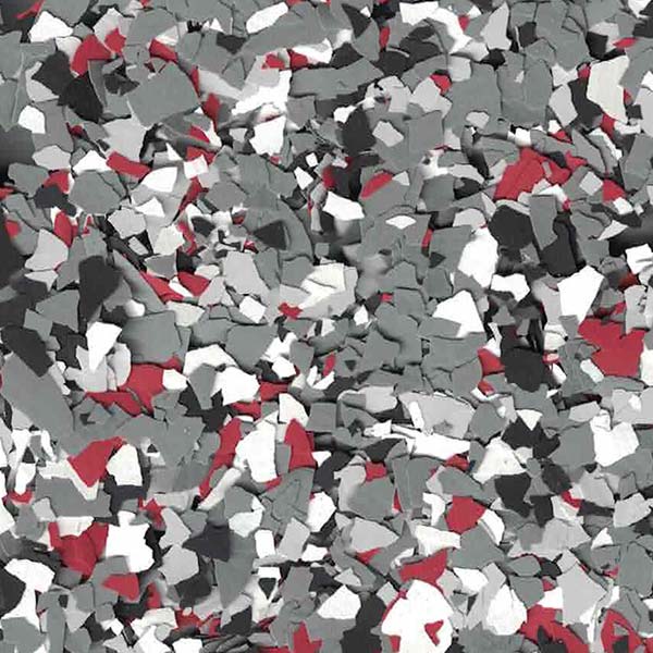 A textured surface composed of small, irregularly shaped fragments in shades of gray, red, and white, forming a visually captivating, abstract pattern.