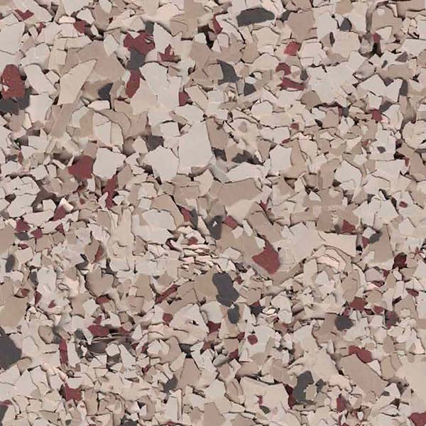 A close-up of a textured surface with beige, brown, and dark fragments creating a speckled pattern, resembling decorative flooring or wall material.