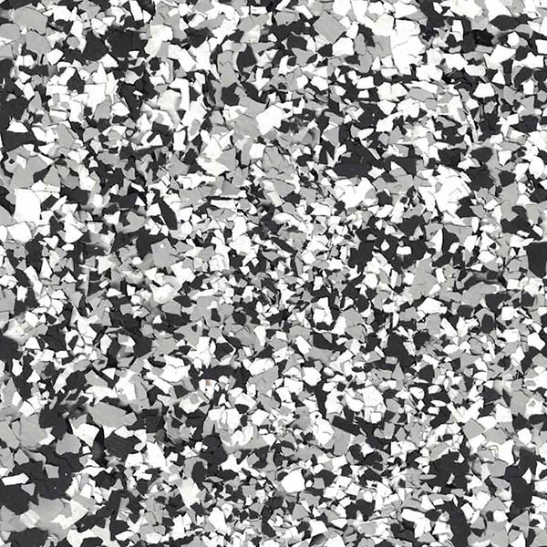 The image shows a close-up of a black, white, and gray speckled texture, resembling a terrazzo flooring pattern with various sized fragments.