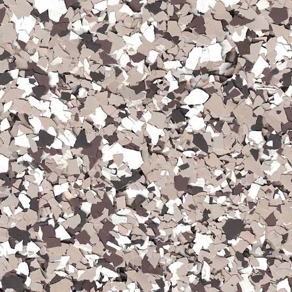 A close-up of a multicolored, speckled surface with various shades of brown, beige, and white, resembling epoxy floor coating patterns.